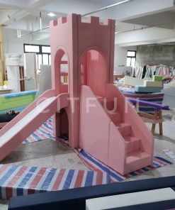 Pink soft play castle with slide